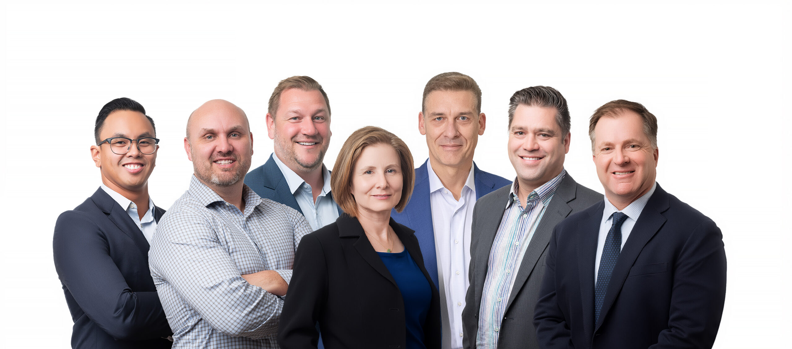 Group shot of the Executive team.Left to Right: Cy Balitbit, VP, Engineering – Public Sector; Cody Moser, VP, Geomatics; Derek Porter, VP, Engineering – Private Sector; Joleen Mazurat, VP, Operations; Sheldon Hudson, President & CEO; Phil Rinn, VP, Landscape Architecture; Darrin Newell, VP, Business Development & Marketing